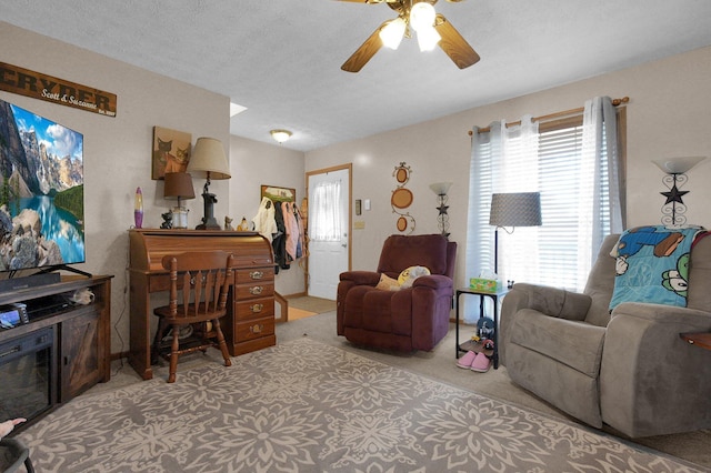 living room featuring carpet floors and ceiling fan