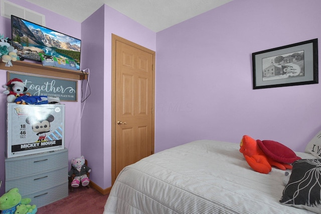 bedroom with visible vents, carpet, and baseboards