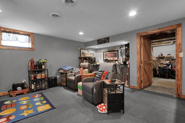 living room with carpet flooring, recessed lighting, and visible vents