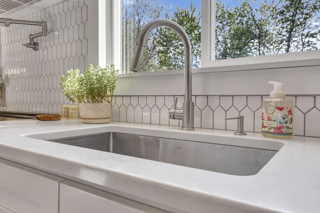 6495 Julian Rd SW, Amanda, OH 43102 - details featuring backsplash, a sink, and light countertops