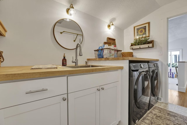 6495 Julian Rd SW, Amanda, OH 43102 - laundry room featuring laundry area, a textured ceiling, wood finished floors, a sink, and washer and clothes dryer