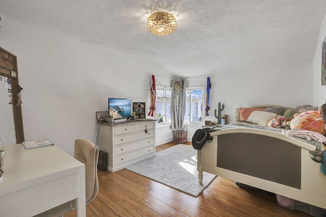 6495 Julian Rd SW, Amanda, OH 43102 - bedroom featuring baseboards, a textured ceiling, and wood finished floors