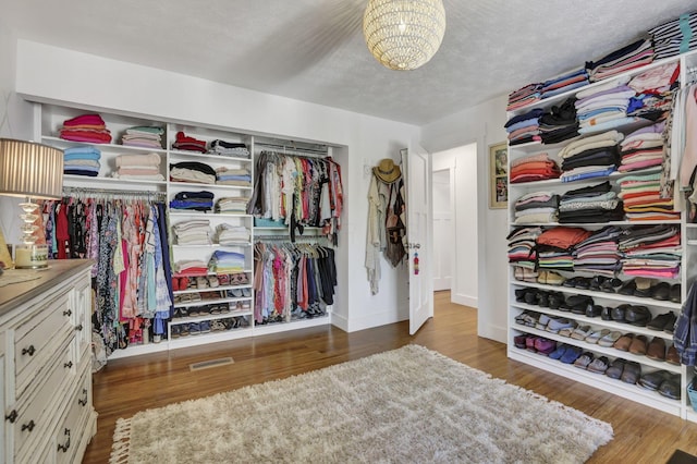 6495 Julian Rd SW, Amanda, OH 43102 - spacious closet with a chandelier, visible vents, and wood finished floors