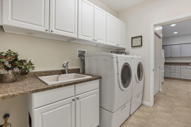 651 Albion Pl, Westerville, OH 43082 - laundry room with independent washer and dryer, recessed lighting, cabinet space, and baseboards