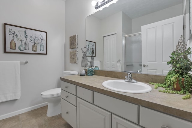651 Albion Pl, Westerville, OH 43082 - bathroom featuring vanity, toilet, an enclosed shower, and baseboards