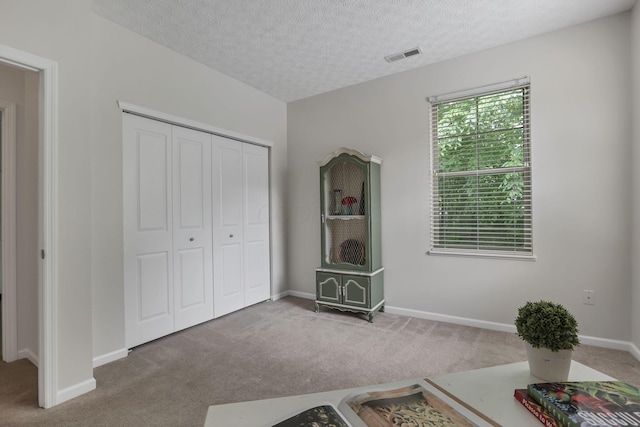 651 Albion Pl, Westerville, OH 43082 - carpeted bedroom with a textured ceiling, a closet, and baseboards