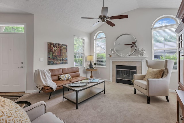 651 Albion Pl, Westerville, OH 43082 - living room with lofted ceiling, healthy amount of natural light, a fireplace, light carpet, and a textured ceiling