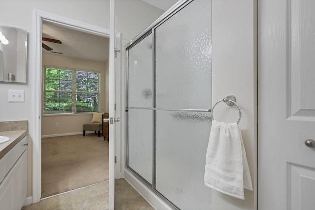 651 Albion Pl, Westerville, OH 43082 - full bath featuring vanity, a shower stall, ceiling fan, tile patterned flooring, and baseboards