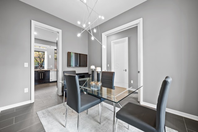 dining area featuring recessed lighting, baseboards, and a notable chandelier