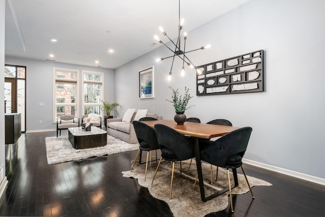 dining area featuring baseboards, recessed lighting, dark wood-style flooring, and a chandelier