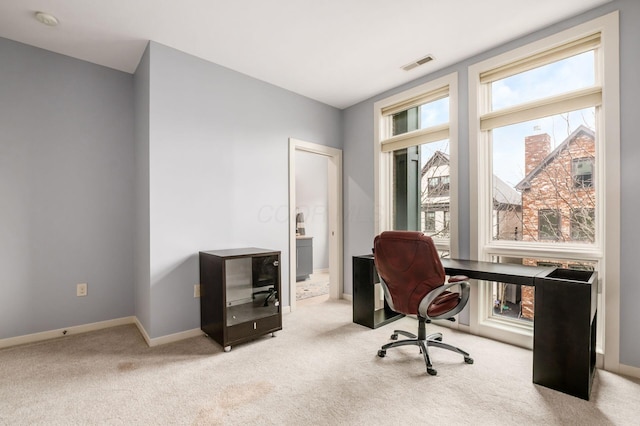 office with visible vents, carpet flooring, and baseboards