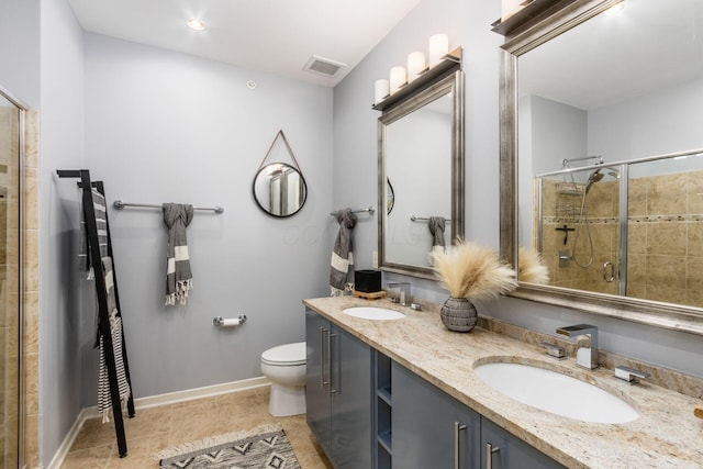 bathroom featuring visible vents, a sink, a stall shower, and toilet