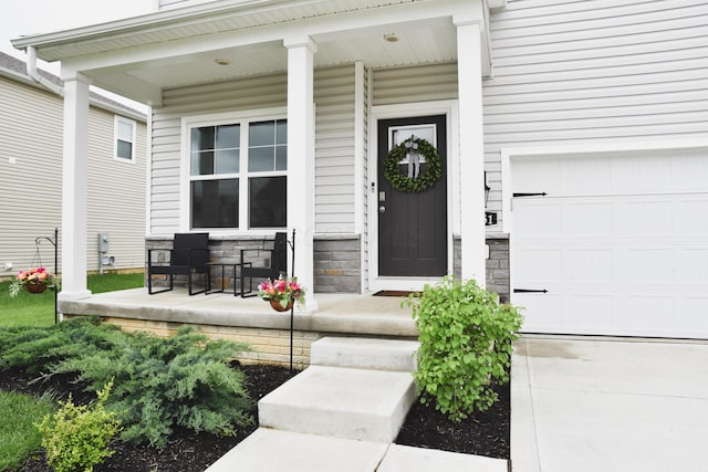 1151 Gelbray Dr, Columbus, OH 43207 - view of exterior entry featuring a porch and stone siding