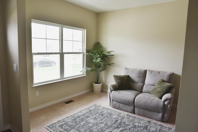1151 Gelbray Dr, Columbus, OH 43207 - living area featuring baseboards, carpet flooring, and visible vents