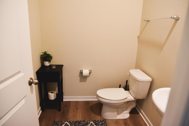 1151 Gelbray Dr, Columbus, OH 43207 - bathroom with toilet, baseboards, and wood finished floors