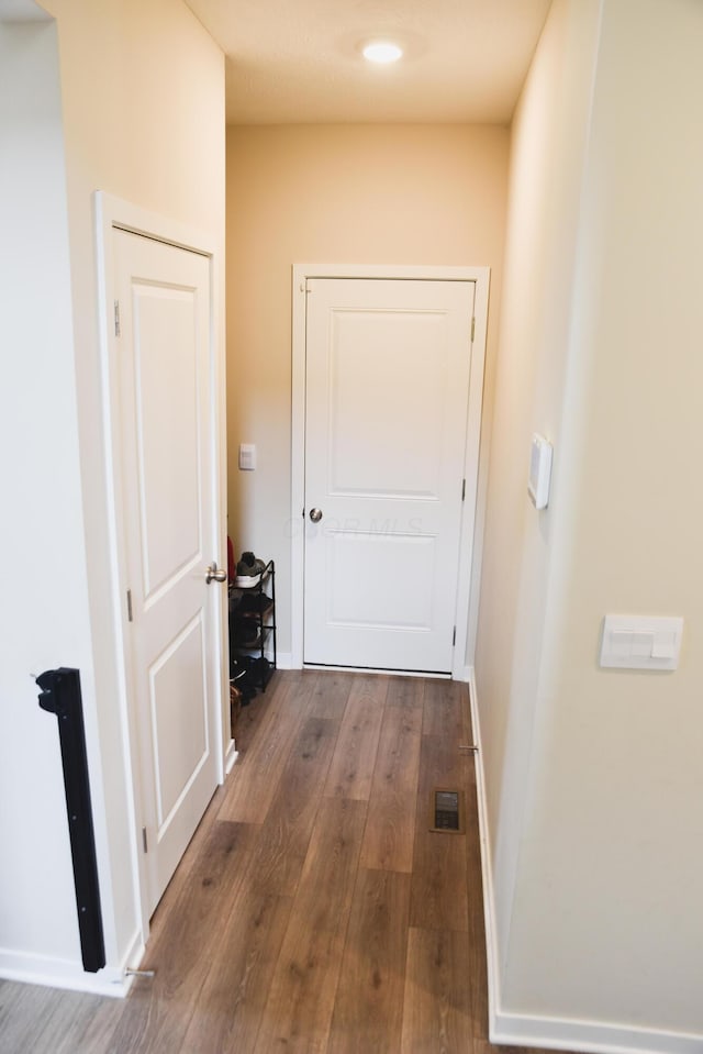 1151 Gelbray Dr, Columbus, OH 43207 - hallway featuring visible vents, baseboards, and wood finished floors