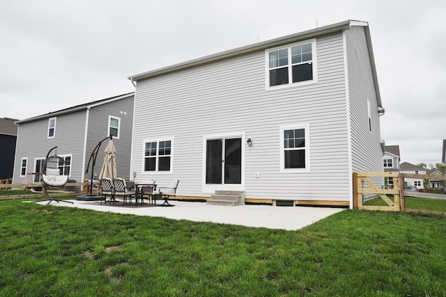 1151 Gelbray Dr, Columbus, OH 43207 - back of property with a lawn, a patio area, fence, and entry steps
