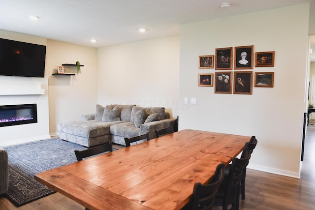 1151 Gelbray Dr, Columbus, OH 43207 - living room with recessed lighting, baseboards, a glass covered fireplace, and dark wood-type flooring