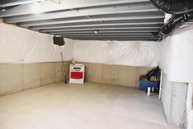 1151 Gelbray Dr, Columbus, OH 43207 - unfinished basement featuring brick wall