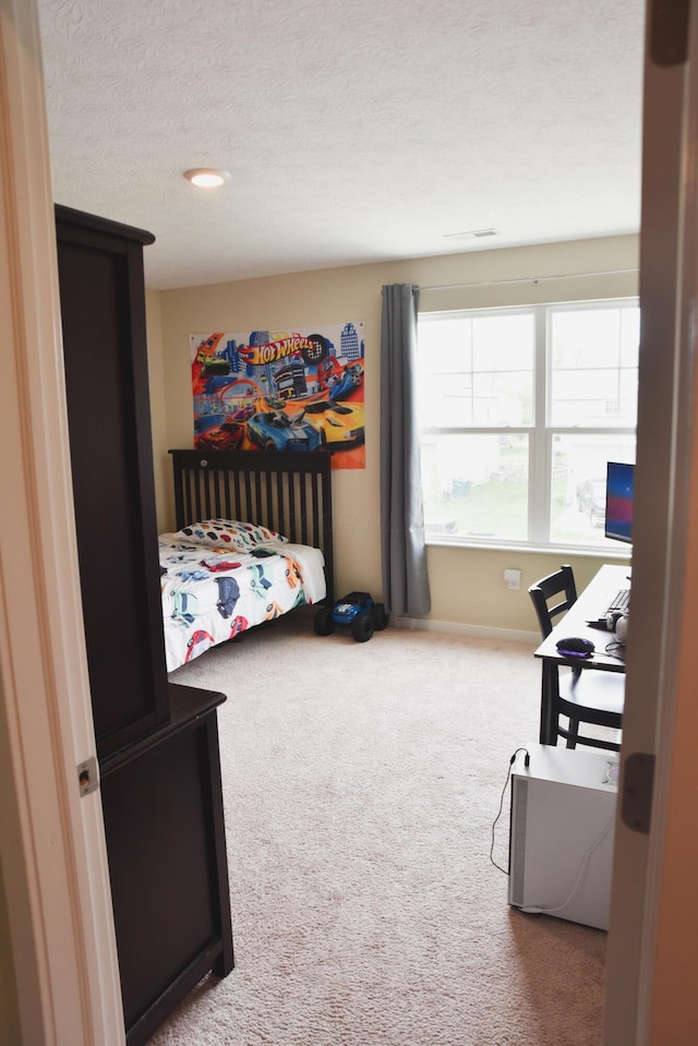 1151 Gelbray Dr, Columbus, OH 43207 - bedroom with carpet flooring, a textured ceiling, and baseboards
