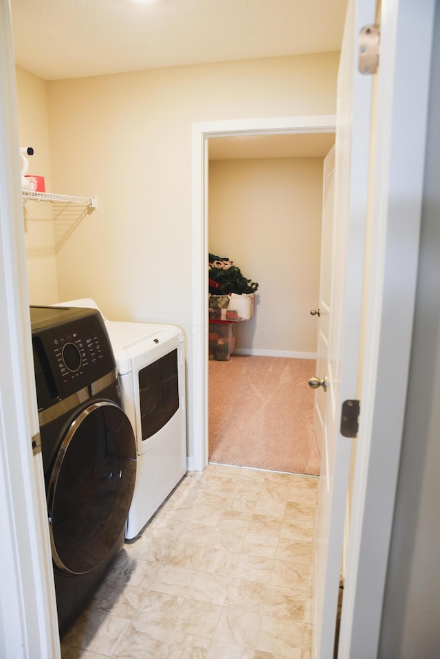 1151 Gelbray Dr, Columbus, OH 43207 - washroom with separate washer and dryer, baseboards, laundry area, and light colored carpet