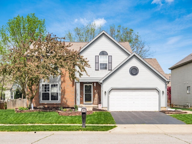 6008 Macnabb Ct, Hilliard, OH 43026 - traditional-style home featuring aphalt driveway, brick siding, fence, a front lawn, and a shingled roof