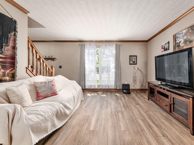 6008 Macnabb Ct, Hilliard, OH 43026 - living area featuring crown molding, light wood finished floors, a textured ceiling, baseboards, and stairway
