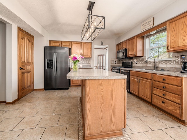 6008 Macnabb Ct, Hilliard, OH 43026 - kitchen featuring light countertops, appliances with stainless steel finishes, decorative backsplash, and a sink