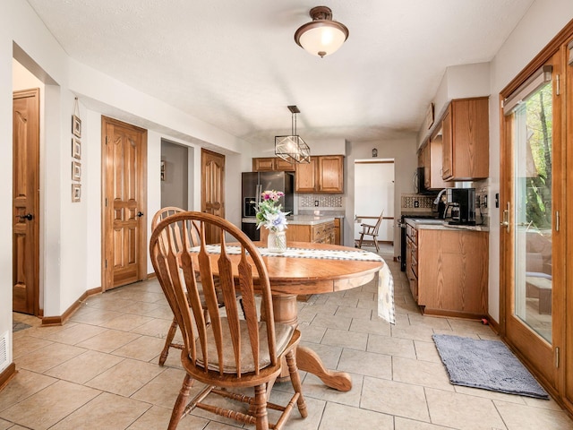 6008 Macnabb Ct, Hilliard, OH 43026 - dining room featuring light tile patterned floors and baseboards