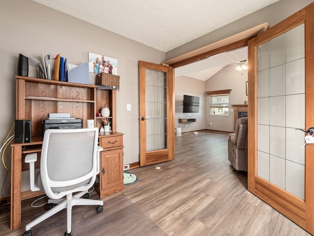 6008 Macnabb Ct, Hilliard, OH 43026 - office area featuring light wood-style floors, baseboards, and vaulted ceiling