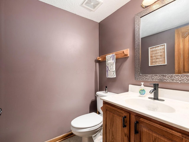 6008 Macnabb Ct, Hilliard, OH 43026 - bathroom with visible vents, a textured ceiling, toilet, and vanity