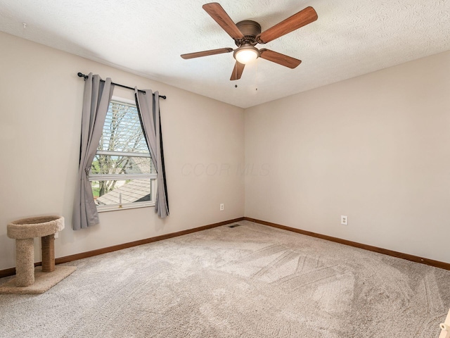6008 Macnabb Ct, Hilliard, OH 43026 - empty room with baseboards, ceiling fan, carpet flooring, and visible vents