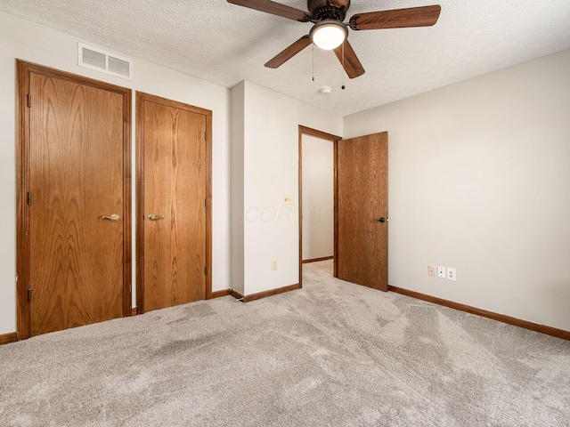 6008 Macnabb Ct, Hilliard, OH 43026 - unfurnished bedroom with carpet flooring, a textured ceiling, baseboards, and visible vents