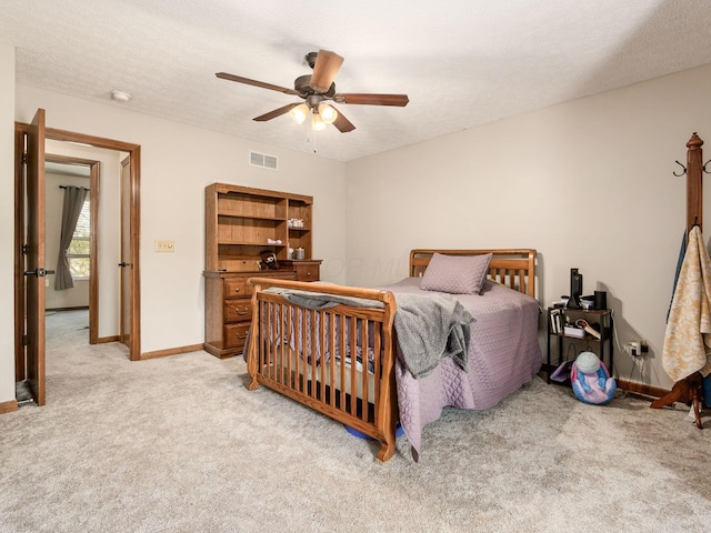 6008 Macnabb Ct, Hilliard, OH 43026 - bedroom with baseboards, visible vents, light carpet, and ceiling fan