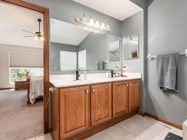 6008 Macnabb Ct, Hilliard, OH 43026 - full bathroom with double vanity, a ceiling fan, visible vents, a sink, and connected bathroom