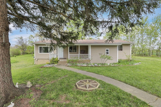 19361 White Stone Rd, Marysville, OH 43040 - ranch-style home with a porch, a front lawn, and a fire pit