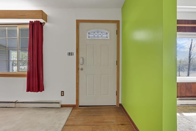 19361 White Stone Rd, Marysville, OH 43040 - foyer entrance with baseboards, baseboard heating, and wood finished floors