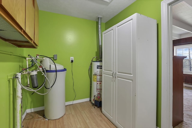 19361 White Stone Rd, Marysville, OH 43040 - washroom with light wood-style floors, baseboards, a baseboard heating unit, hookup for a washing machine, and water heater