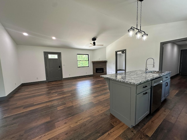 7624 Edria Ln, Athens, OH 45701 - kitchen featuring a sink, dishwasher, ceiling fan, open floor plan, and a fireplace