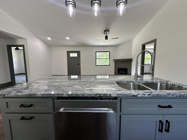 7624 Edria Ln, Athens, OH 45701 - kitchen featuring stainless steel dishwasher, ceiling fan, a sink, vaulted ceiling, and open floor plan