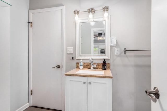 bathroom with ceiling fan and vanity