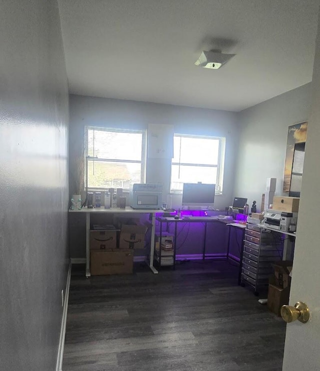 office space with wood finished floors and a healthy amount of sunlight