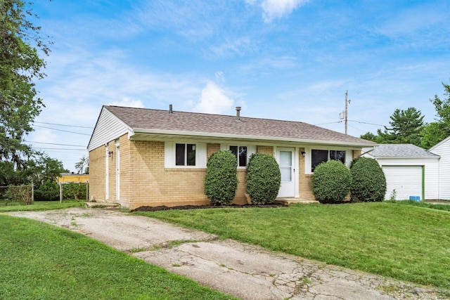 5068 Tremaine Ct, Columbus, OH 43232 - ranch-style house featuring brick siding, a front yard, and a shingled roof