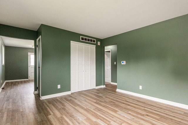 5068 Tremaine Ct, Columbus, OH 43232 - unfurnished bedroom with wood finished floors and a closet