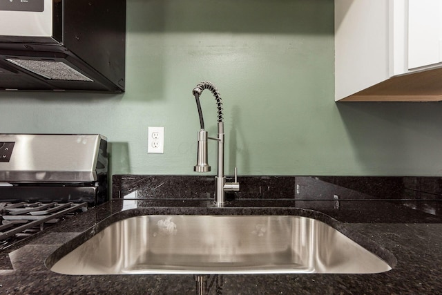 5068 Tremaine Ct, Columbus, OH 43232 - kitchen view of a sink and dark stone counters
