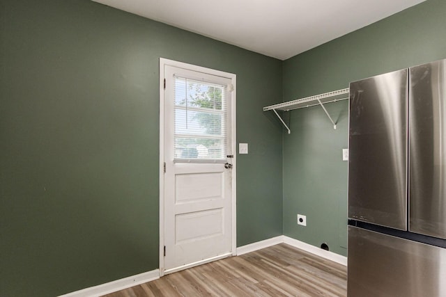 5068 Tremaine Ct, Columbus, OH 43232 - washroom with hookup for an electric dryer and light wood-style floors