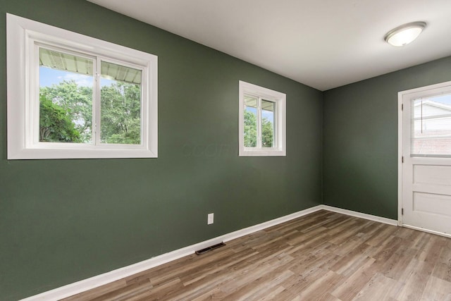 5068 Tremaine Ct, Columbus, OH 43232 - spare room with wood finished floors and healthy amount of natural light