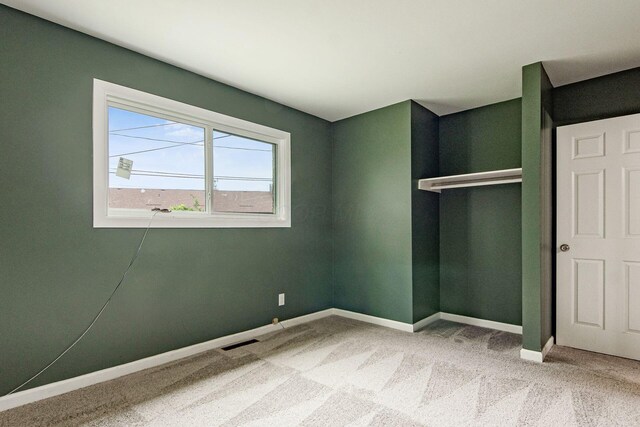 5068 Tremaine Ct, Columbus, OH 43232 - unfurnished bedroom featuring light colored carpet and baseboards