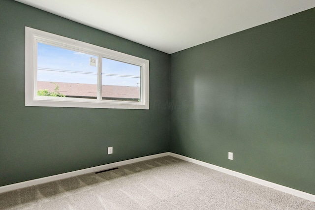5068 Tremaine Ct, Columbus, OH 43232 - carpeted empty room with baseboards