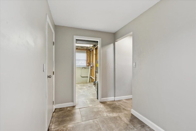4096 Jonquil St, Columbus, OH 43224 - hallway featuring baseboards and concrete floors